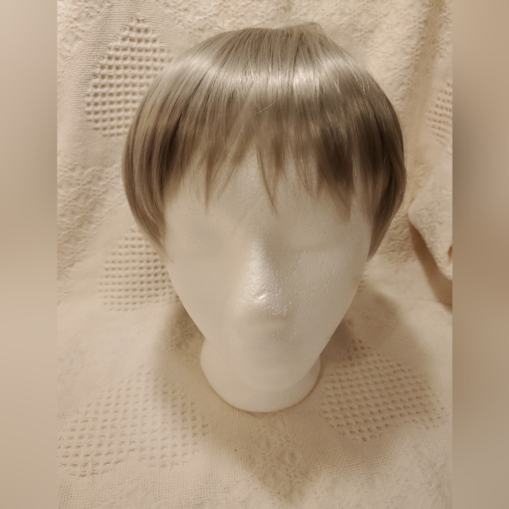 SHORT METALIC SILVER WIG, NO TAG OR LABEL.